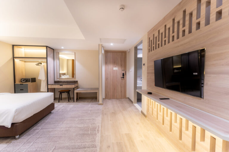 A full view of the Studio King room at Skye Hotel Phnom Penh, capturing its spacious layout and elegant urban aesthetic.